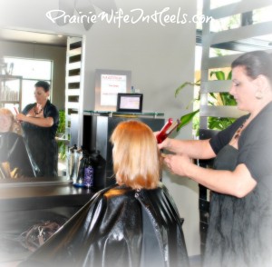 Hairstylist straightening hair