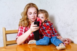 mom with kid on phone